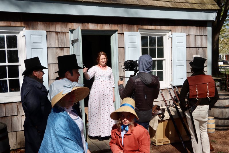 Jenny Donovan, a professional actor playing tavern owner Sarah Marriner, steps out of the Sussex Tavern April 8 on the Historic Lewes Shipcarpenter Campus during the shooting of an interpretive film on Lewes’ maritime history. This particular scene was called “Chaos” and was set during the bombardment of the town during the War of 1812. Many Lewes residents volunteered for roles in the film. BILL SHULL PHOTOS